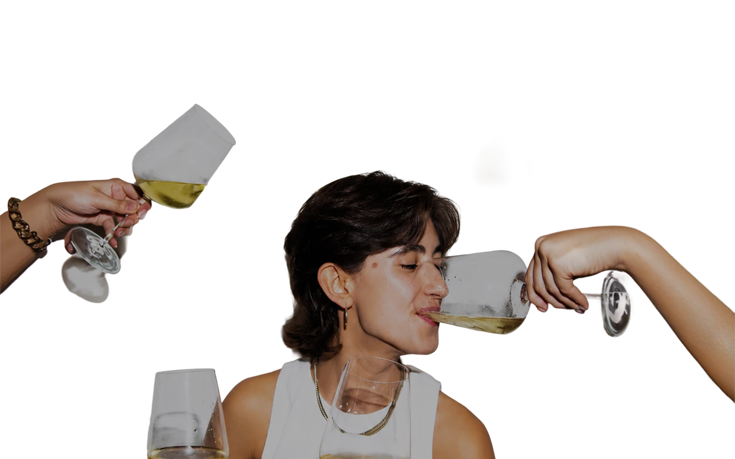 A woman sipping white wine while friends raise their glasses around her